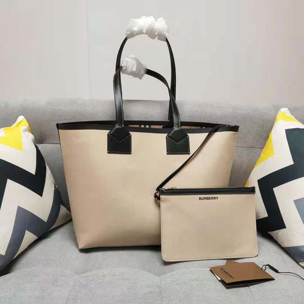 Side profile showing spacious interior of Burberry Women Label Print Cotton Medium London Tote Bag