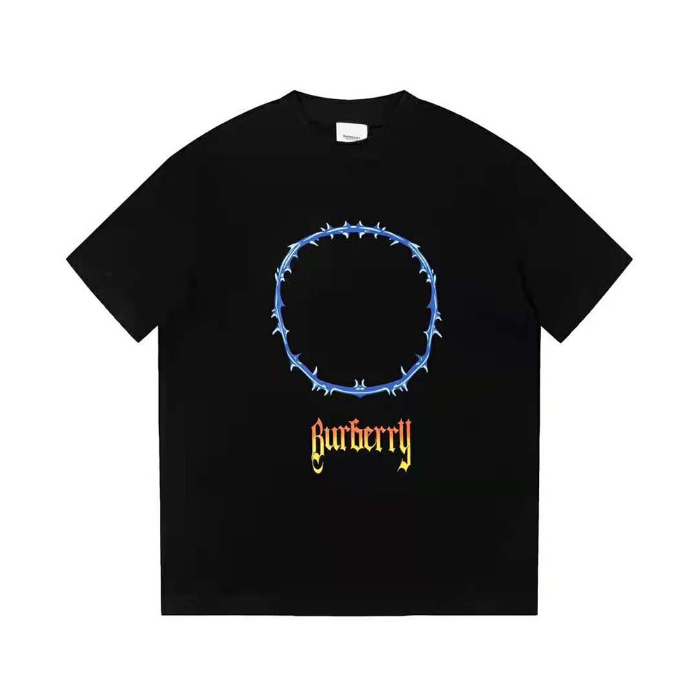 Close-up of thorn and Burberry logo print on black cotton T-shirt
