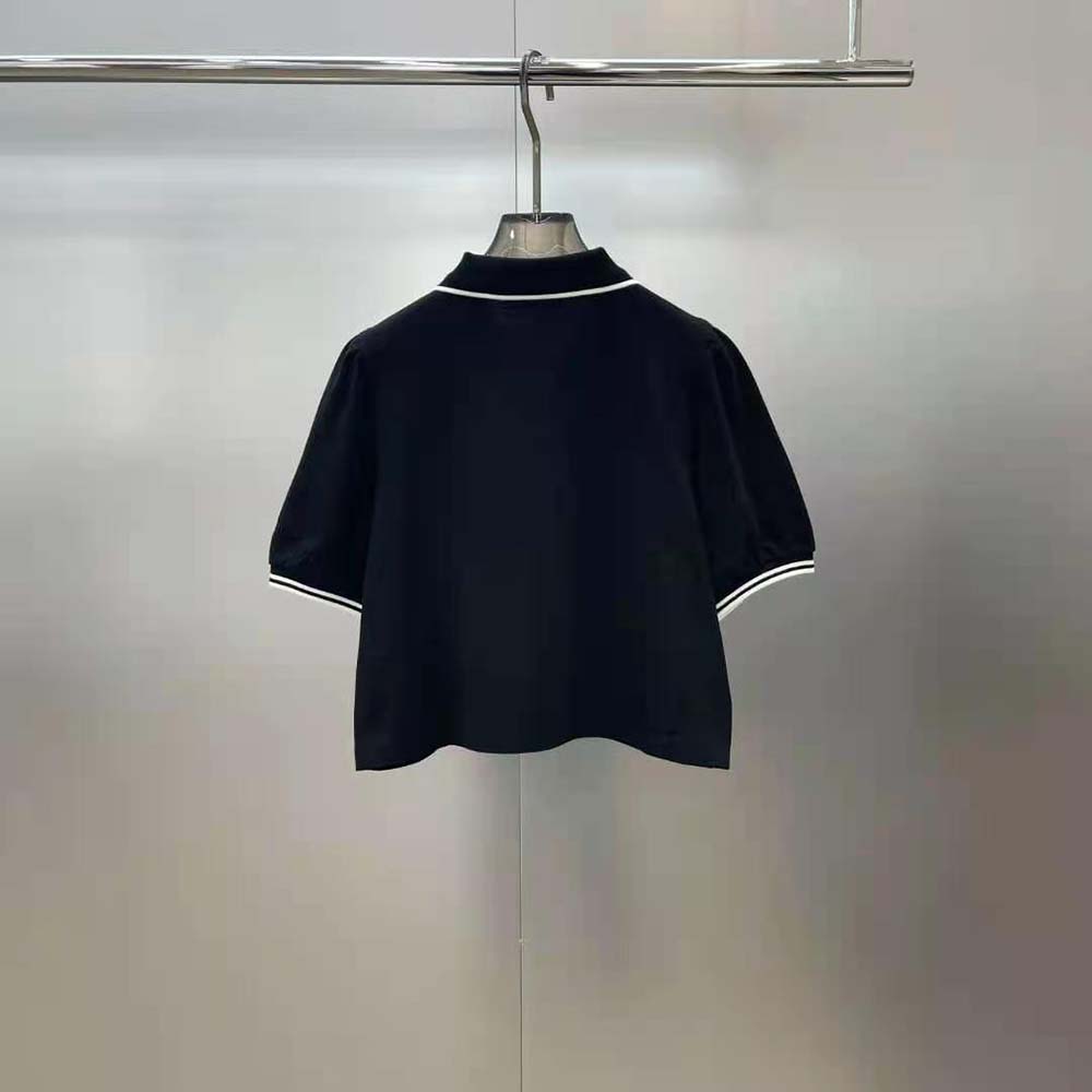 Side angle showing fit of Celine Women Cropped Triomphe Polo Shirt