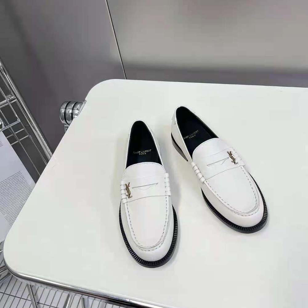 Close-up detail of smooth white leather on Celine Women Le Loafer Penny Slippers