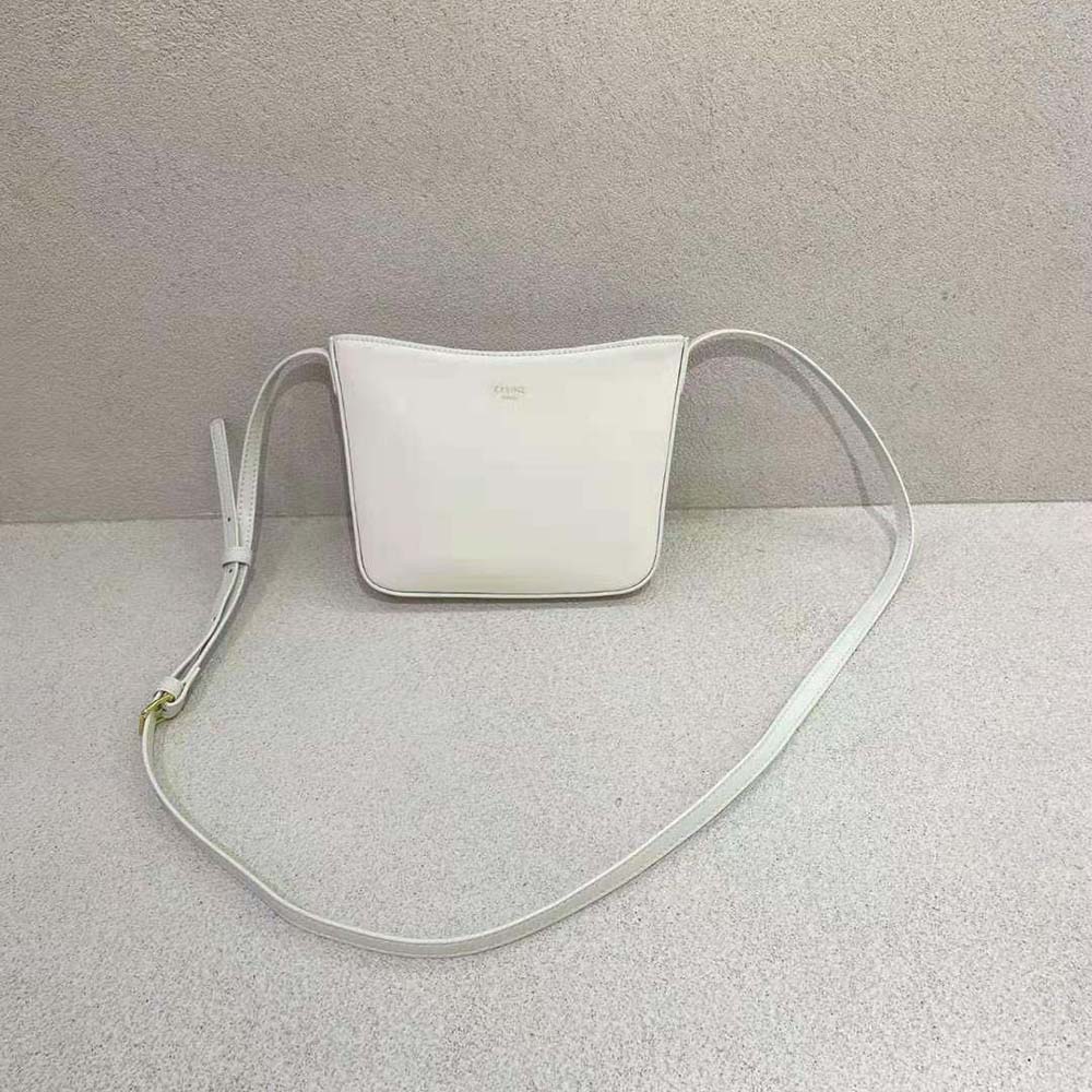 Close-up of shiny white calfskin and gold-tone hardware on Celine Croque Bag