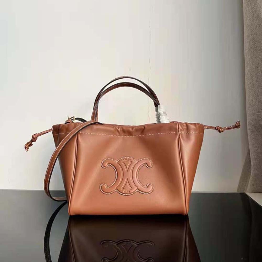 Close-up of gold-tone Triomphe hardware on Celine Women Small Cabas Drawstring Cuir Triomphe