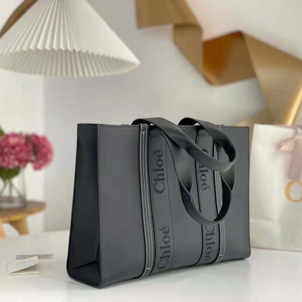 Side angle showing spacious interior and zip closure of Chloe Women Large Woody Tote Bag