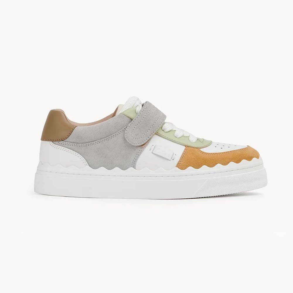Side view of Chloe Women Lauren Sneaker with Strap-Brown showing leather texture