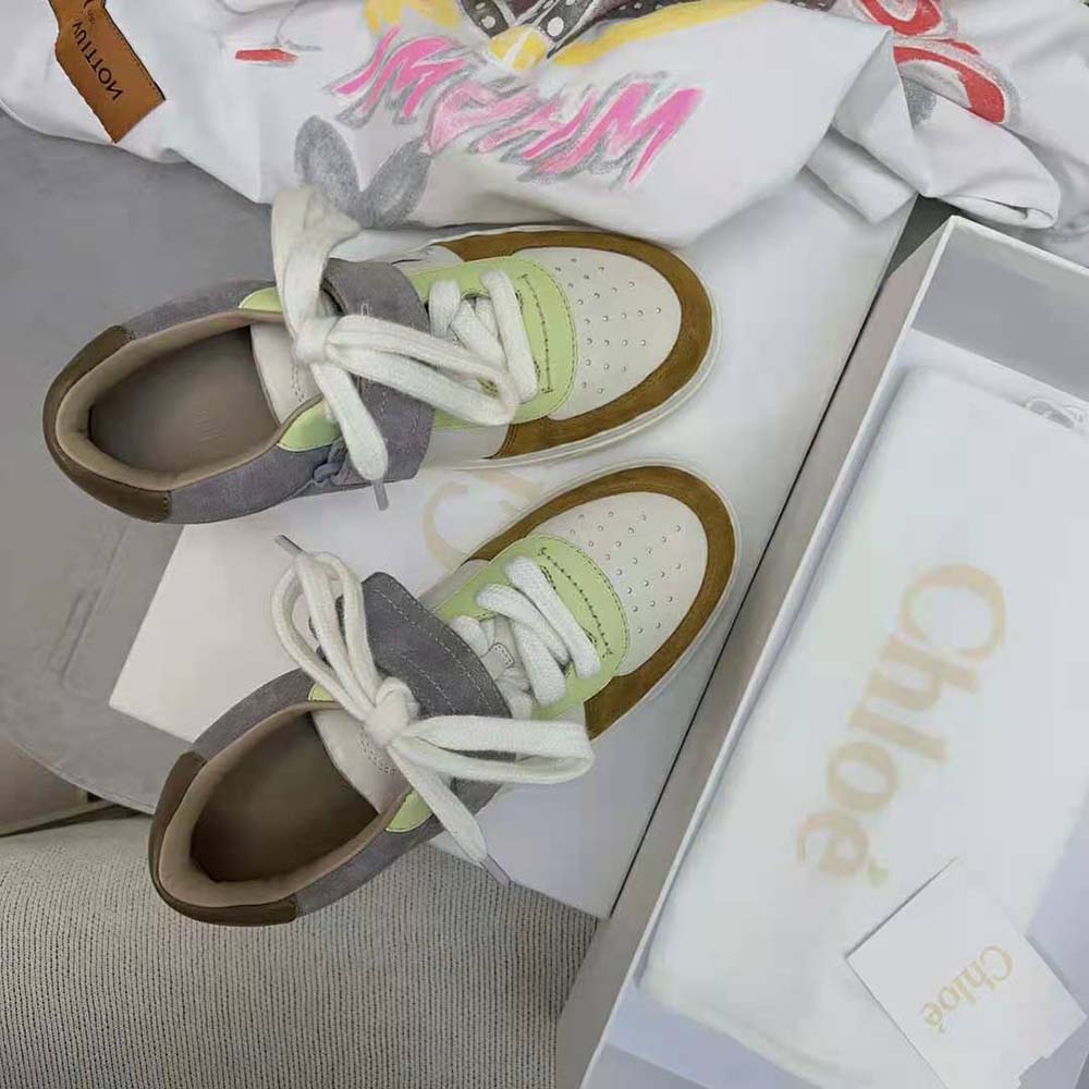 Close-up of adjustable strap and gold-tone hardware on Chloe Women Lauren Sneaker