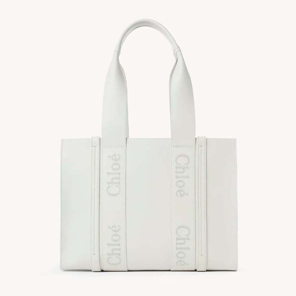 Front view of Chloe Women Medium Woody Tote Bag with embroidered logo in white