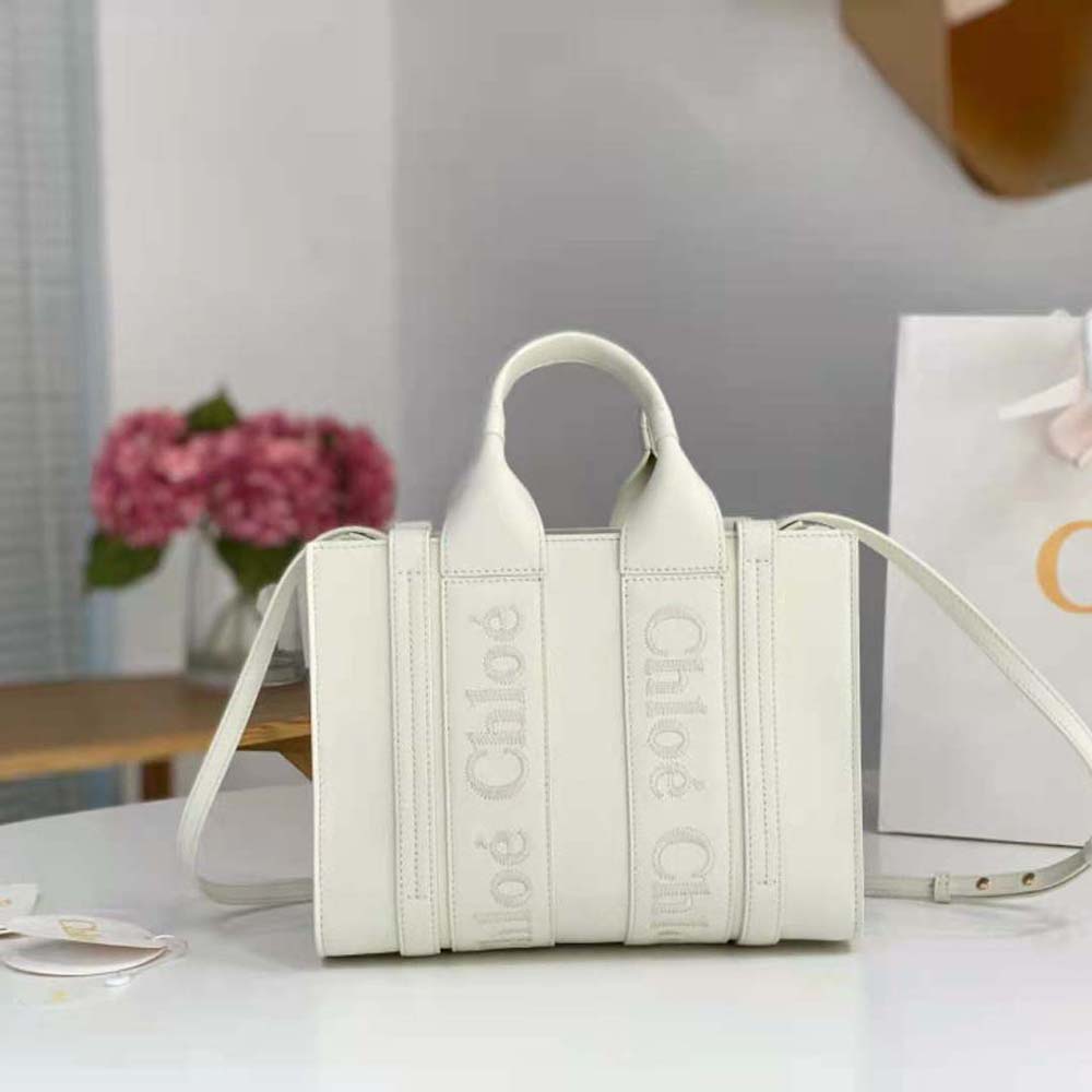 Close-up on embroidered Chloé logo detail on white leather tote bag