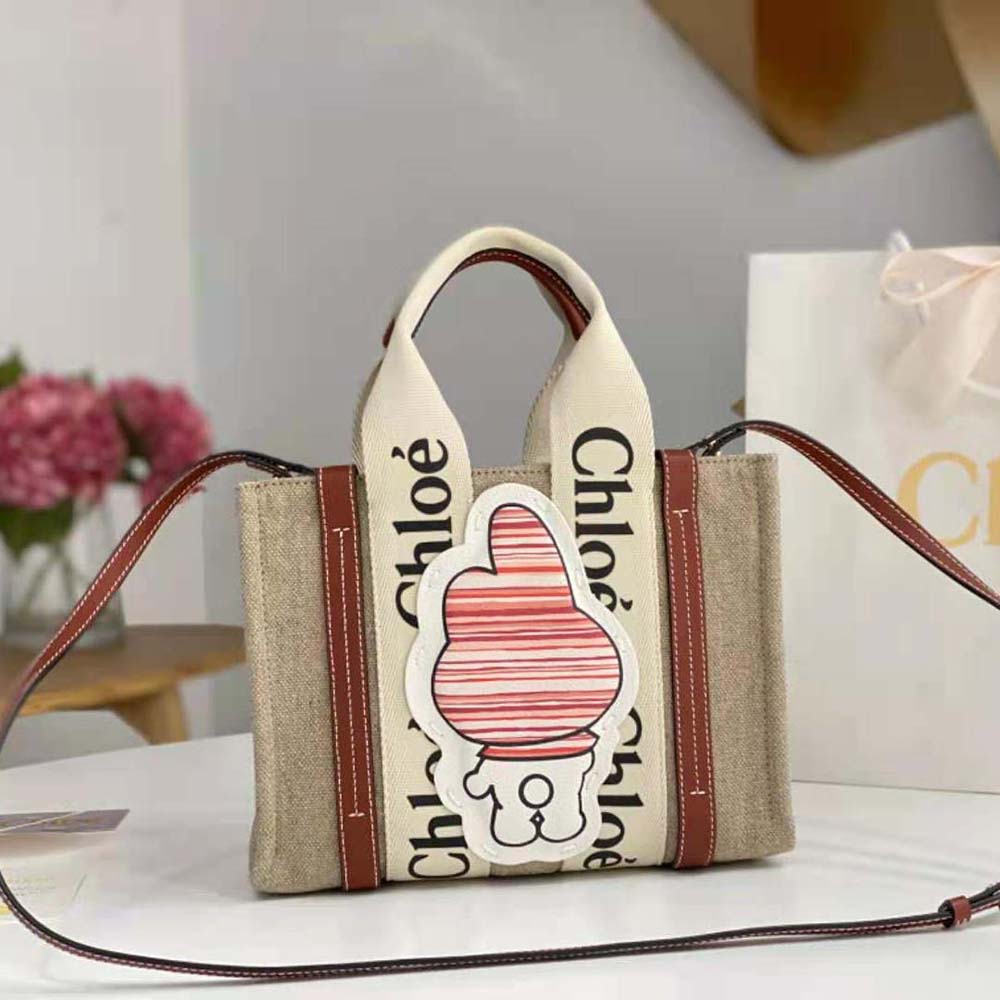 Side angle showing compact silhouette of Chloe Women My Melody Small Woody Tote Bag
