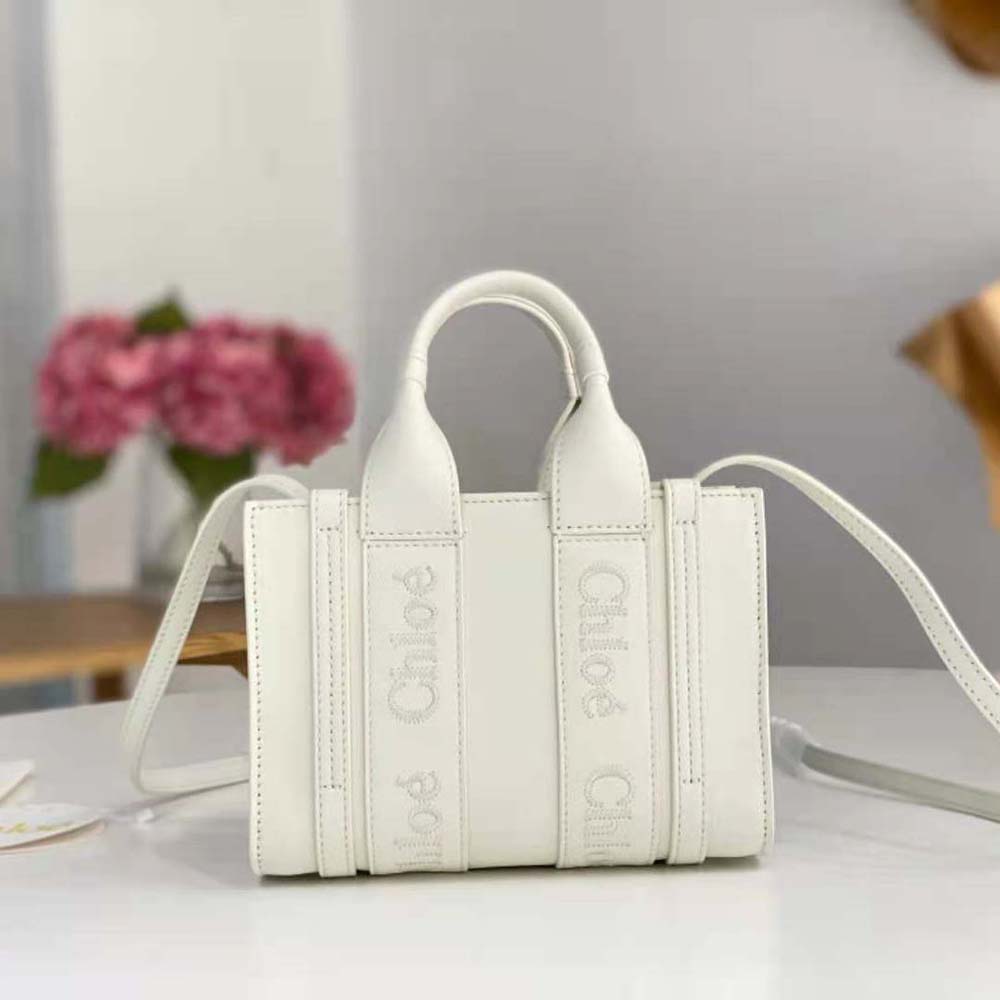 Close-up of embroidered Chloé logo detail on small Woody tote bag