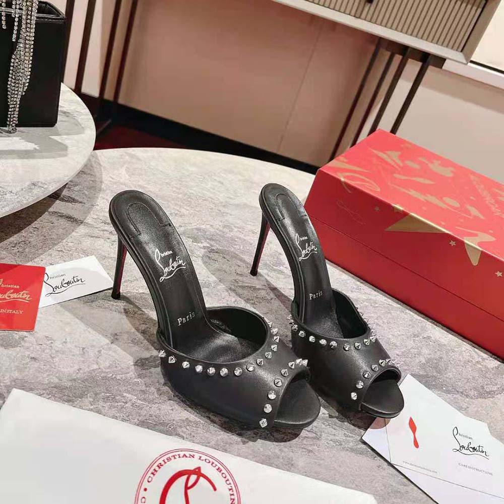 Close-up on black spikes and nappa leather of Me Dolly Spike 85 mm sandals
