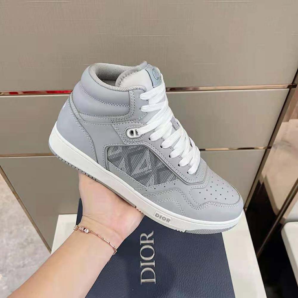 Top angle showing lacing and gray smooth calfskin on Dior Men B27 High-Top Sneaker