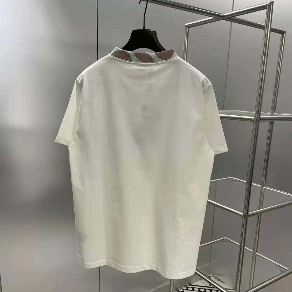 Side angle showing relaxed fit of Dior Men Dior and Duncan Grant white T-shirt