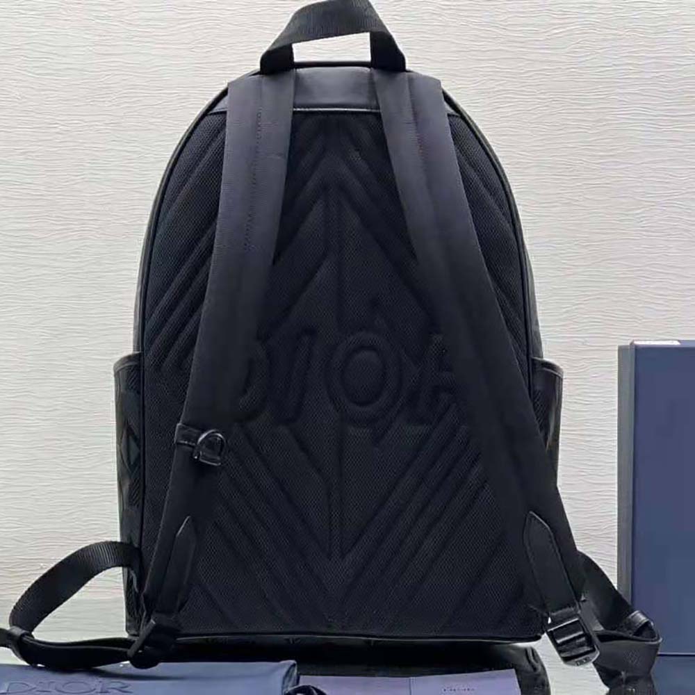 Side angle showing silhouette and adjustable straps of Dior Men Explorer Backpack