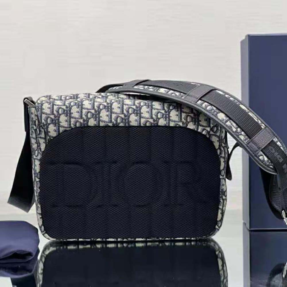 Side angle showing structured silhouette of Dior Men Explorer Messenger Bag