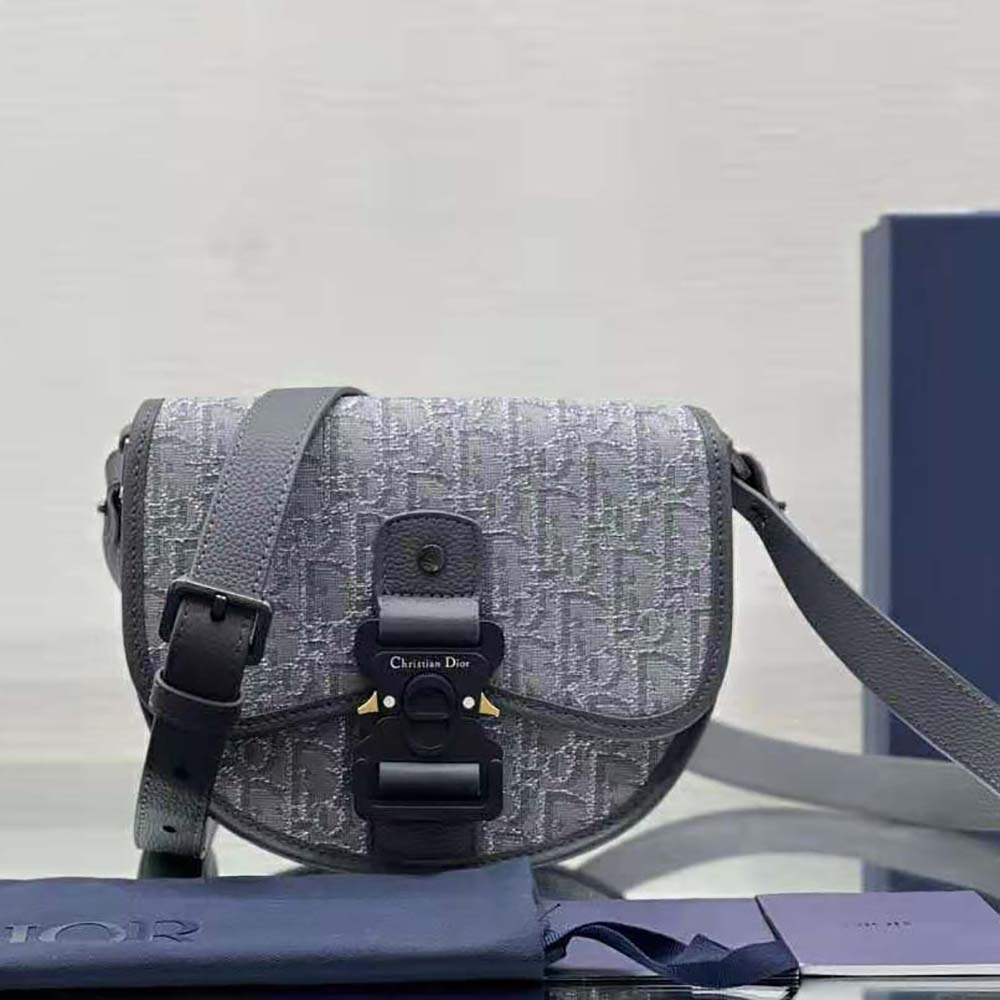 Close-up of ruthenium-colored hardware on Dior Men Mini Gallop Bag