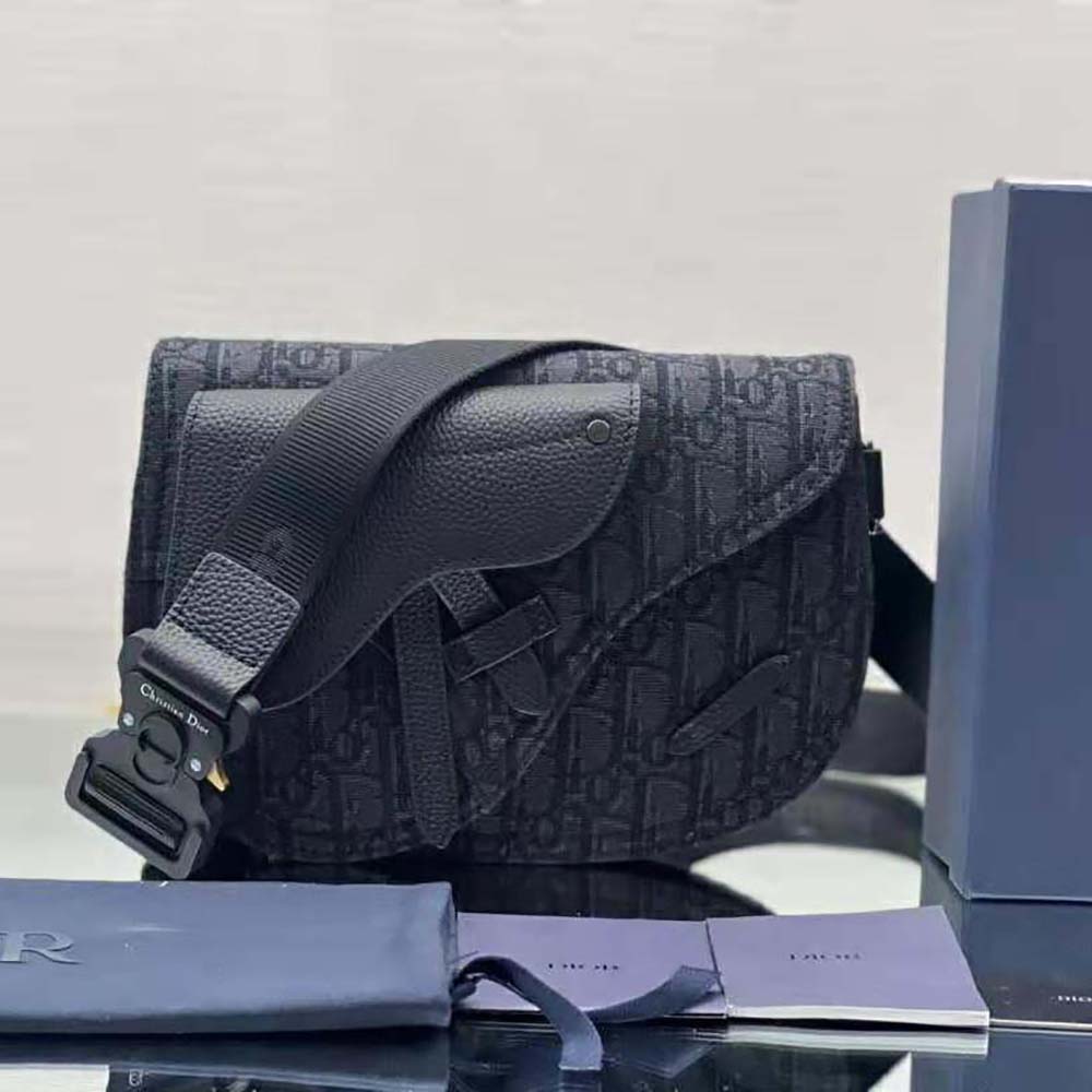 Close-up of black Dior Oblique jacquard fabric and gunmetal hardware