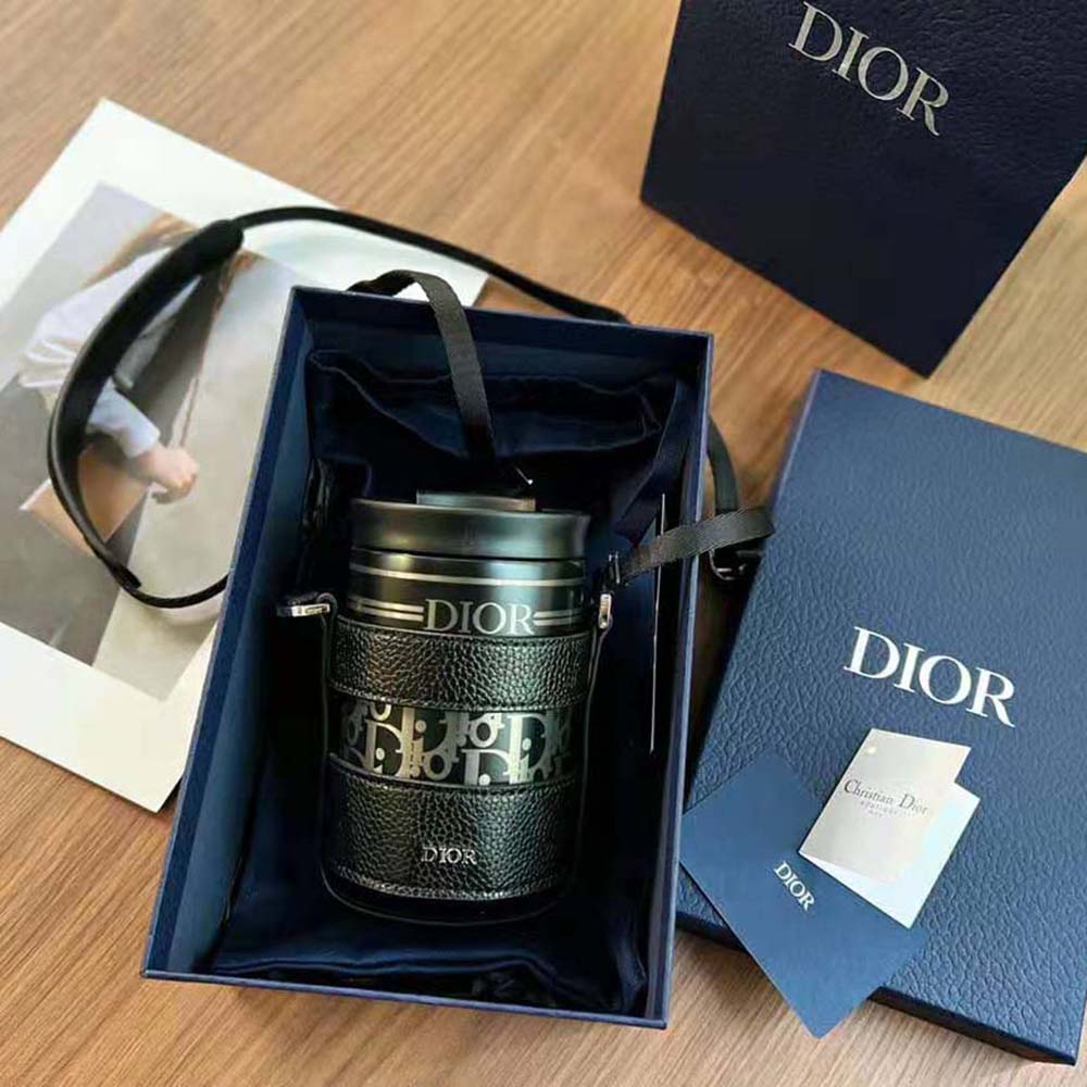 Close-up of Dior Oblique stainless steel hardware on Aqua Mug
