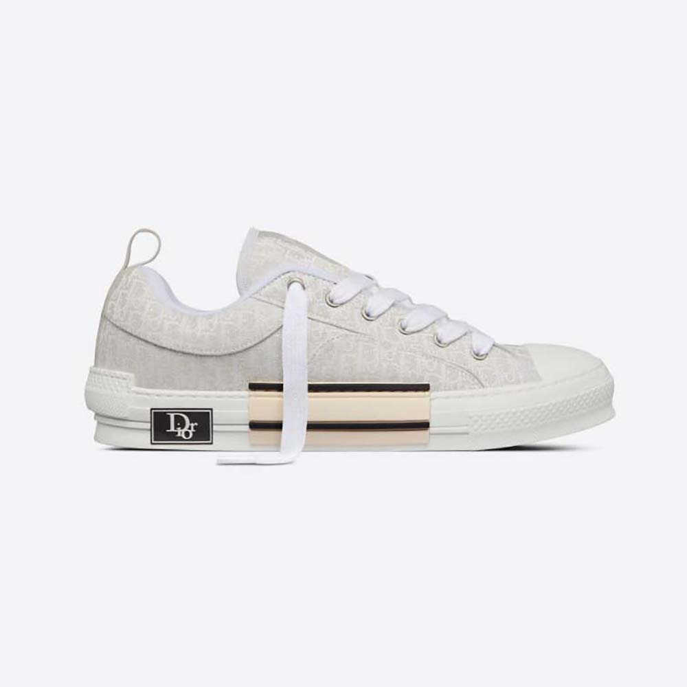 Side profile of Dior Men B23 Skater Sneaker Cream Dior Oblique Jacquard
