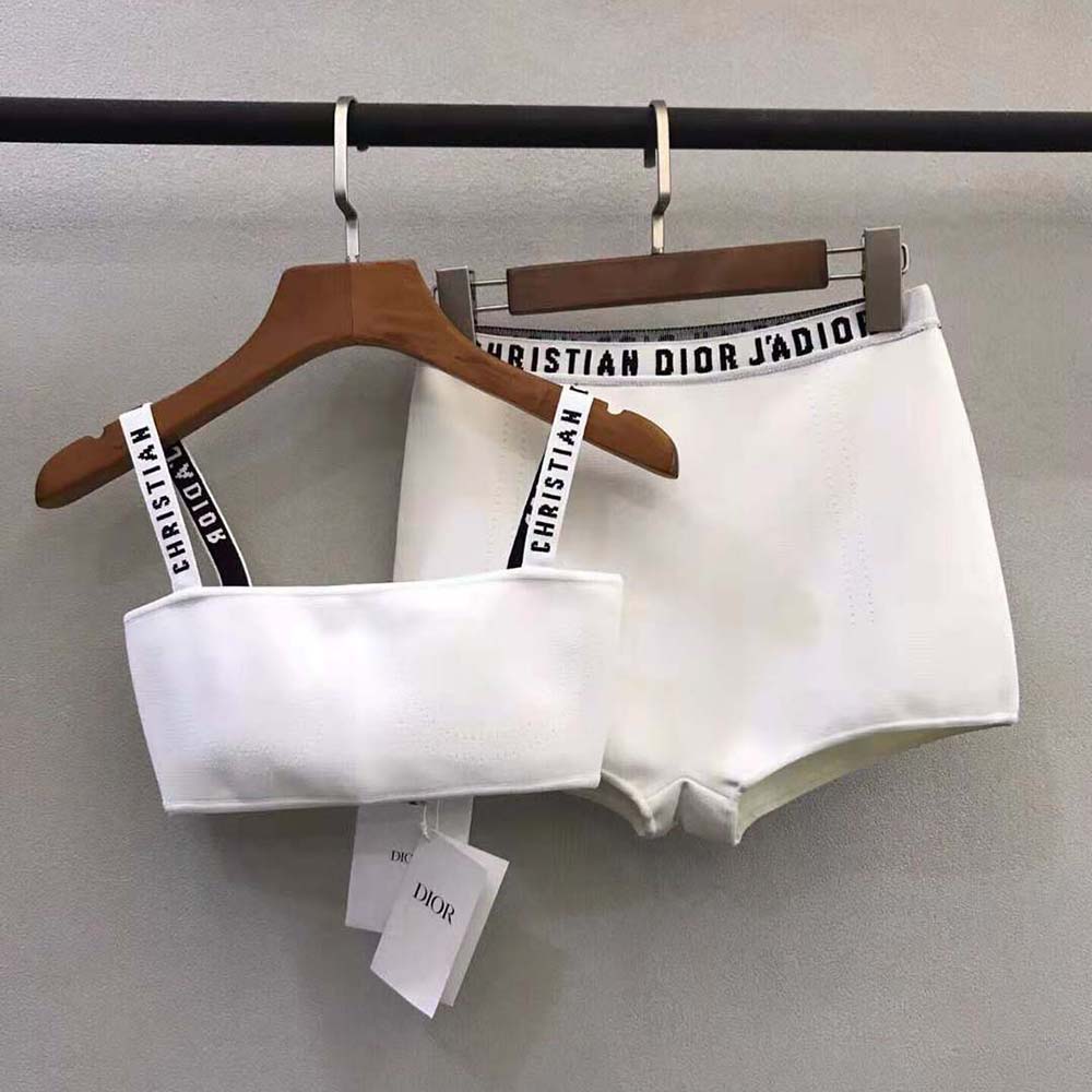 Close-up showing texture and Dior logo on white bralette fabric