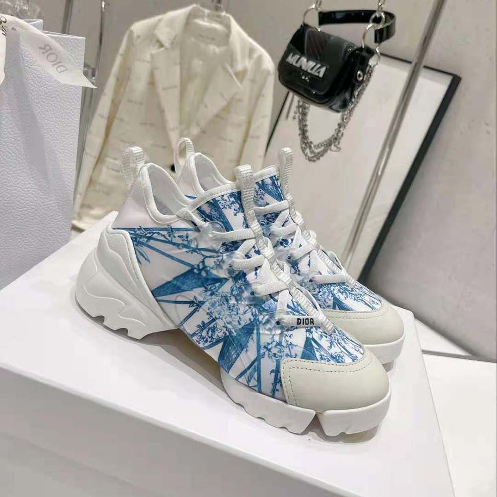 Side profile highlighting silhouette and Dior hardware on Blue Multicolor sneaker