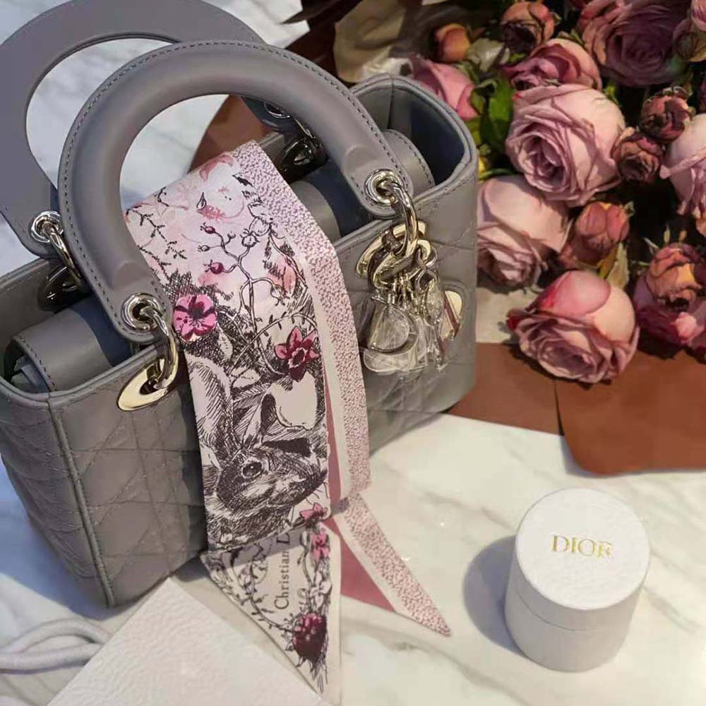Close-up detail of pink multicolor print on Dior Women Jardin Magique Mitzah Scarf