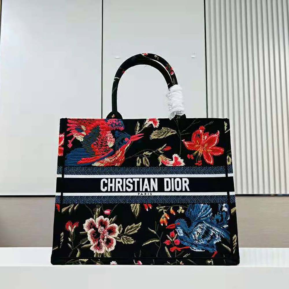 Close-up detail of Dior Birds embroidery on large black Dior tote