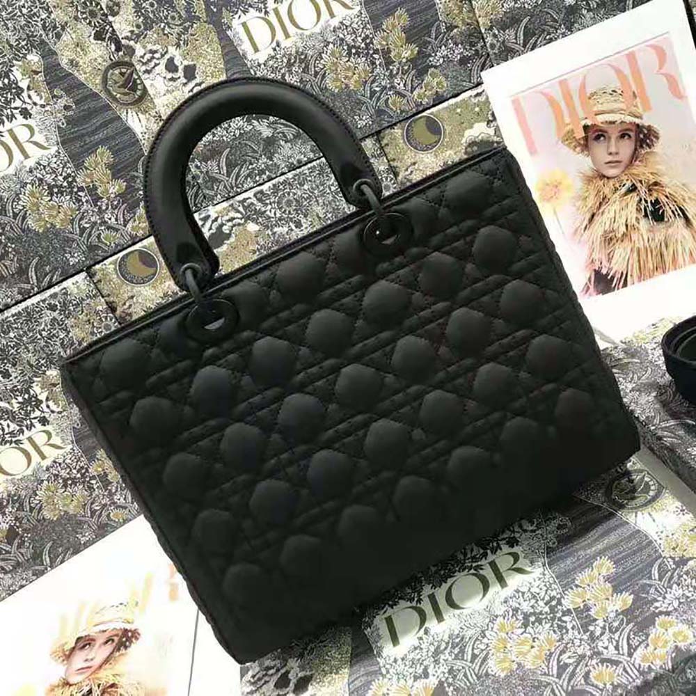 Side angle showing silver-tone hardware on Dior Women Large Lady Dior Bag
