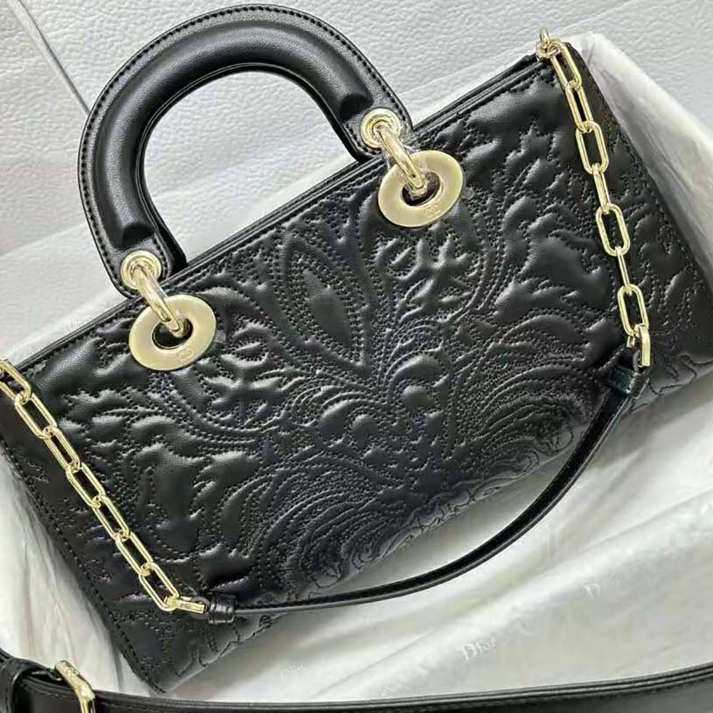 Side angle showing medium silhouette and chain strap of Dior Lady D-joy bag