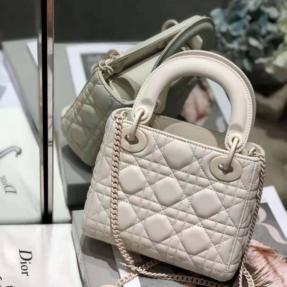 Side angle showing silver-tone closure on Dior Women Mini Lady Dior Bag