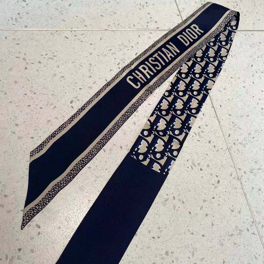 Close-up detail of signature Oblique print on Dior scarf