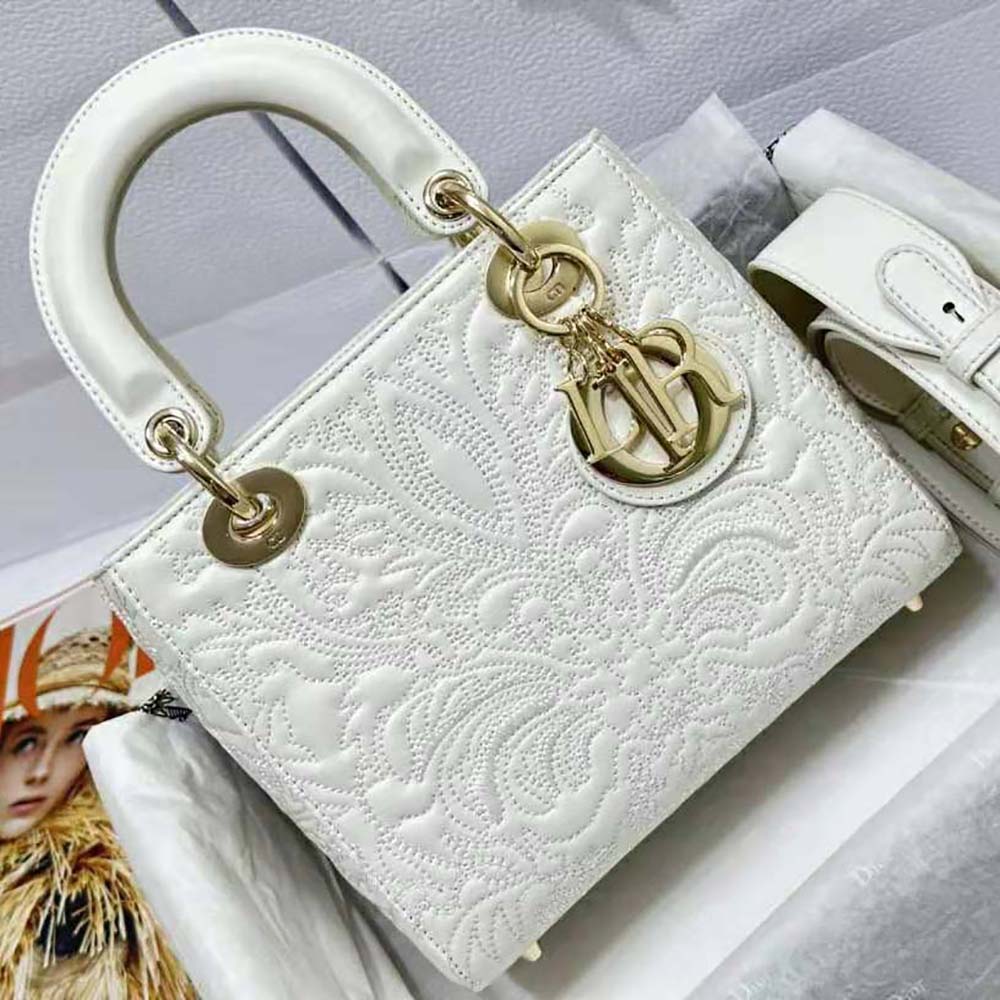 Close-up of quilted-effect lambskin and gold ornamental motif on the Lady Dior my Abcdior Bag