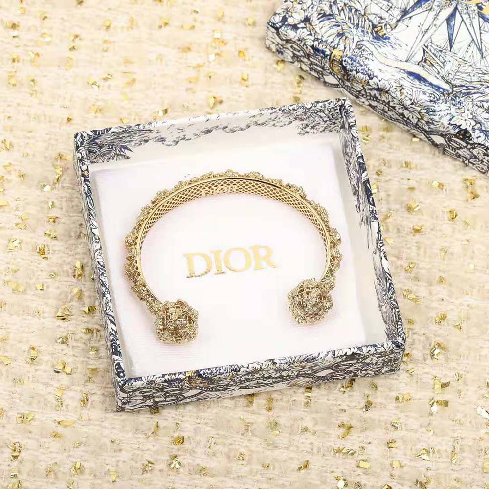 Side angle showing curved silhouette of Dior Women Tribales Bangle Gold-Finish Metal