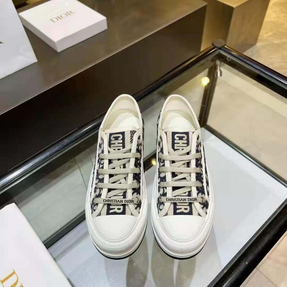 Close-up detail of Dior Oblique embroidery on sneaker upper