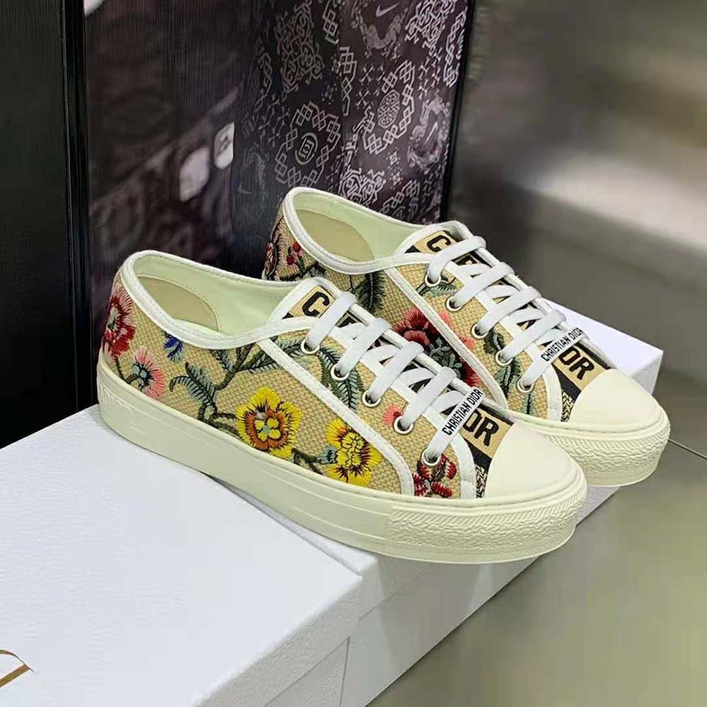 Overhead shot showing beige and multicolor raffia details on Dior sneaker