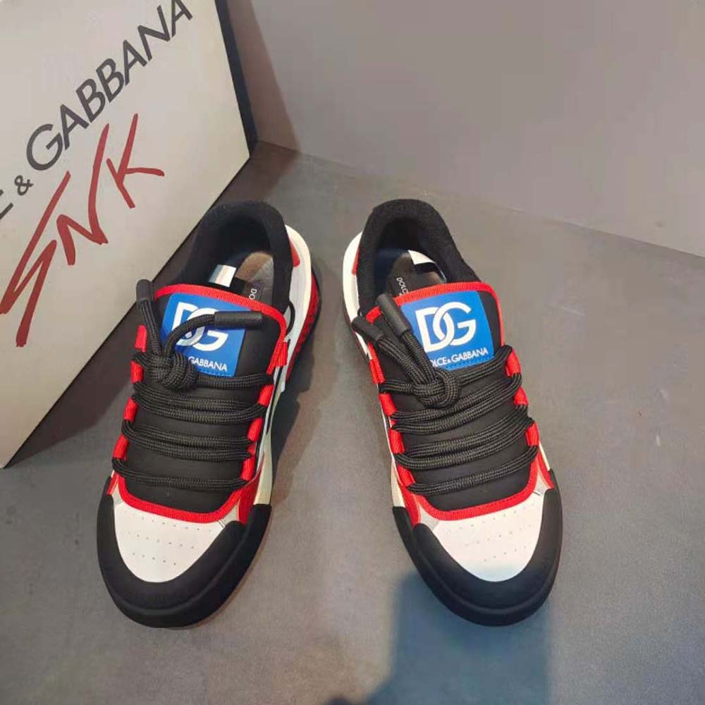 Close-up of red leather and D&G logo hardware on Portofino Sneakers