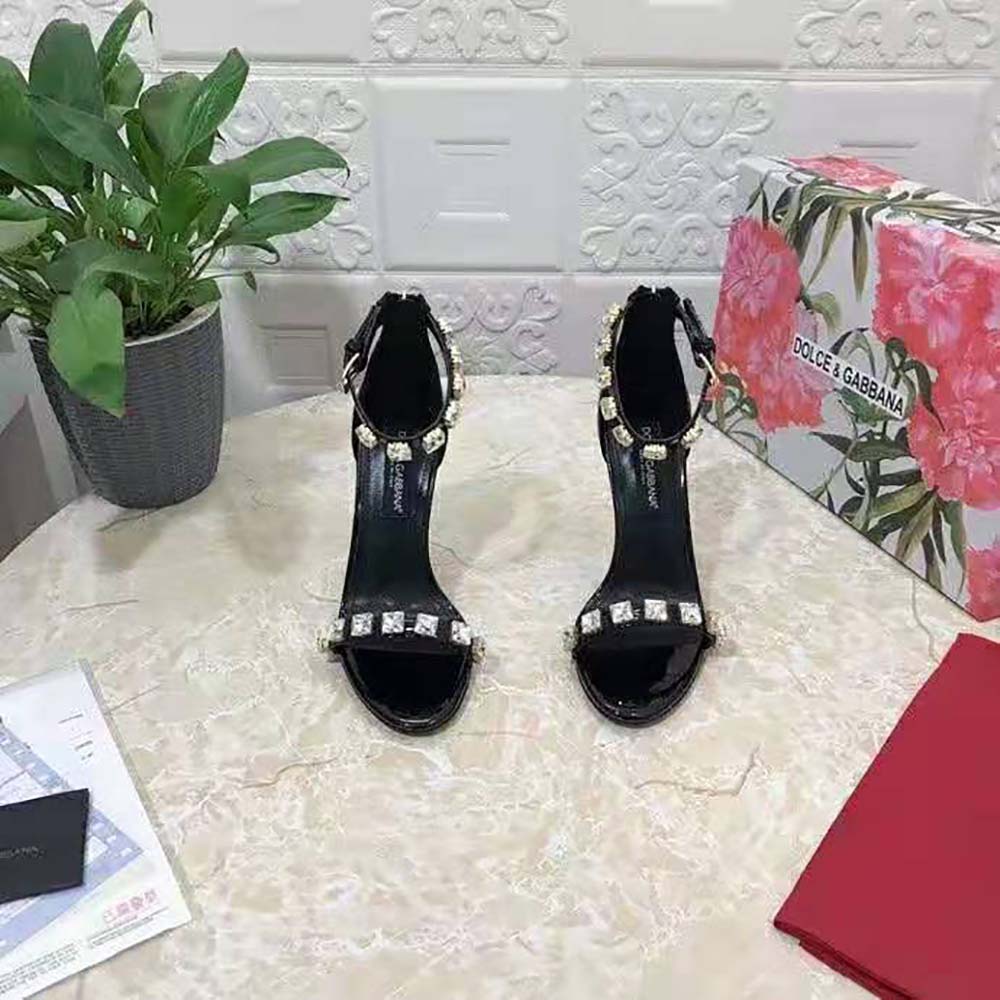 Close-up of rhinestone ankle strap on Dolce Gabbana D&G polished sandals