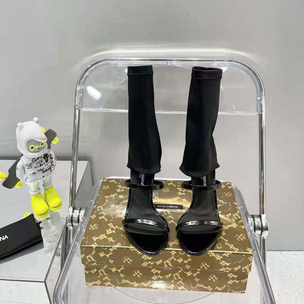 Close-up of black polished calfskin and signature logo on D&G sandals