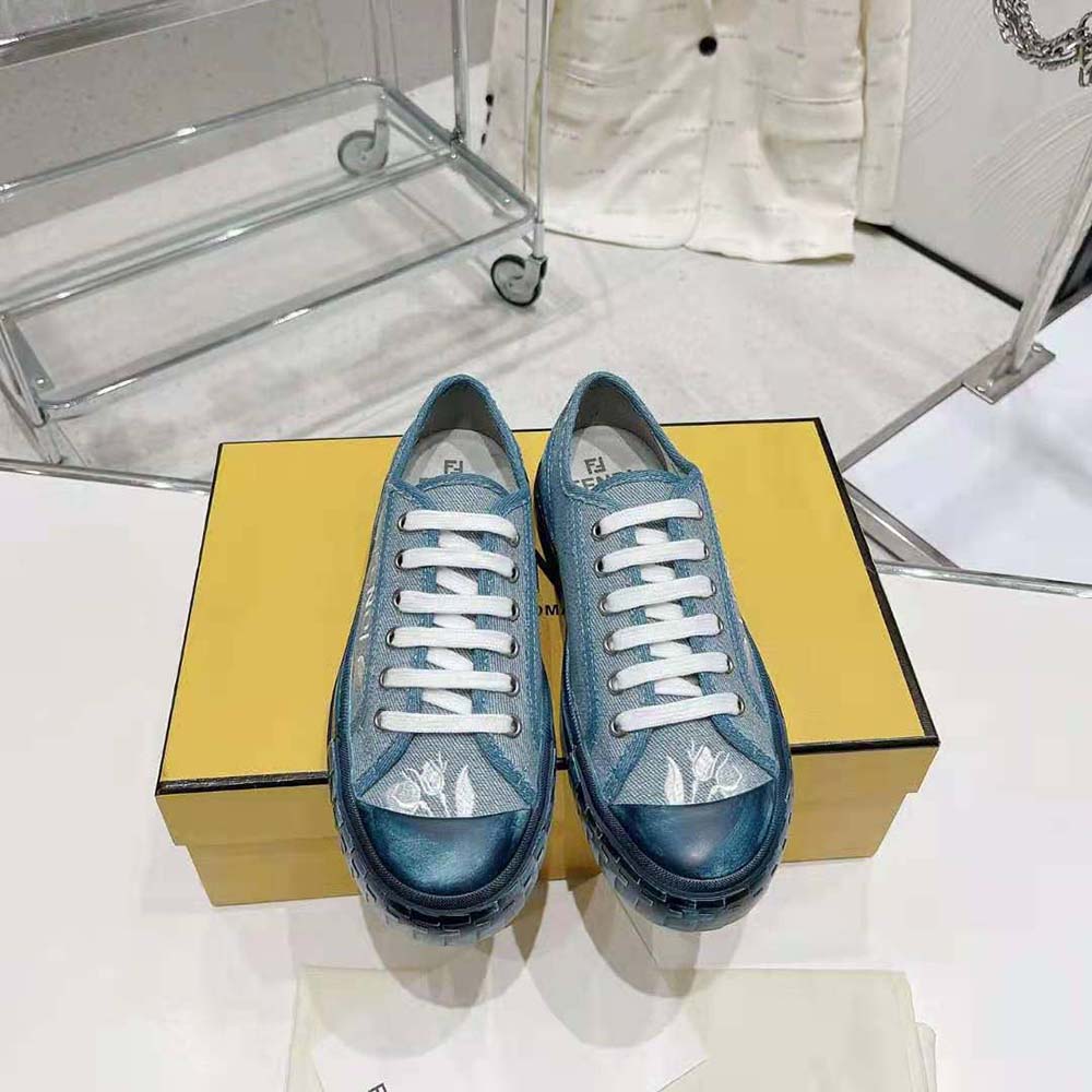 Close-up detail of denim and leather trim on Fendi Men Domino Light Blue Denim Low Tops