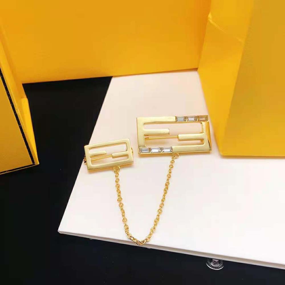 Detail shot highlighting Fendi logo on Gold Coloured Baguette Brooch