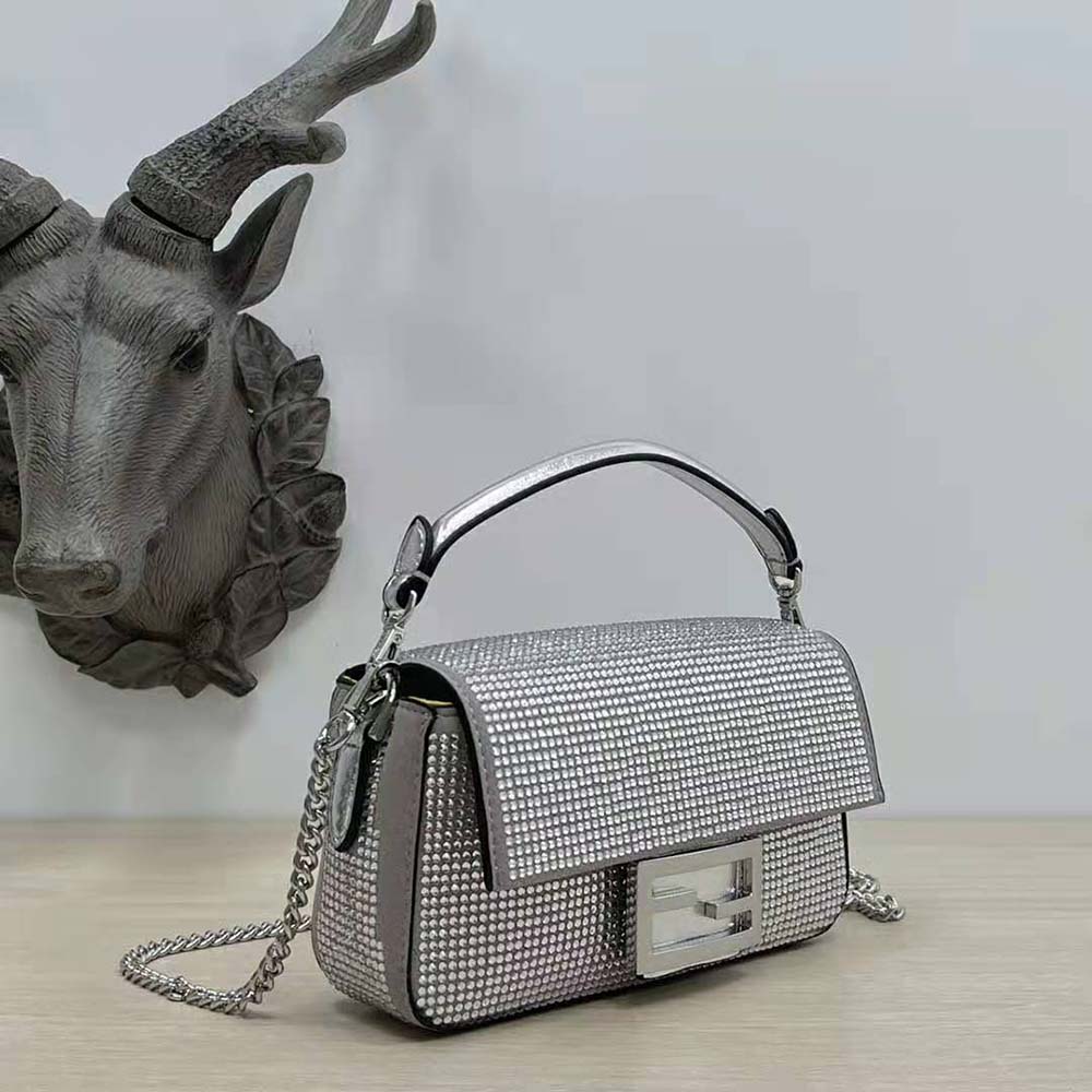 Side angle showcasing silhouette of Fendi Women Baguette Mini Silver Crystals Bag