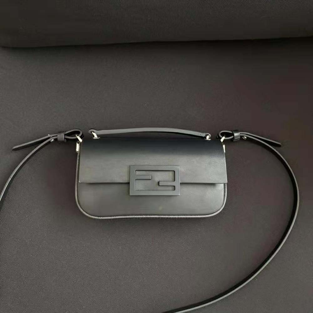 Close-up of gold-tone hardware on Fendi Women Baguette Phone Pouch