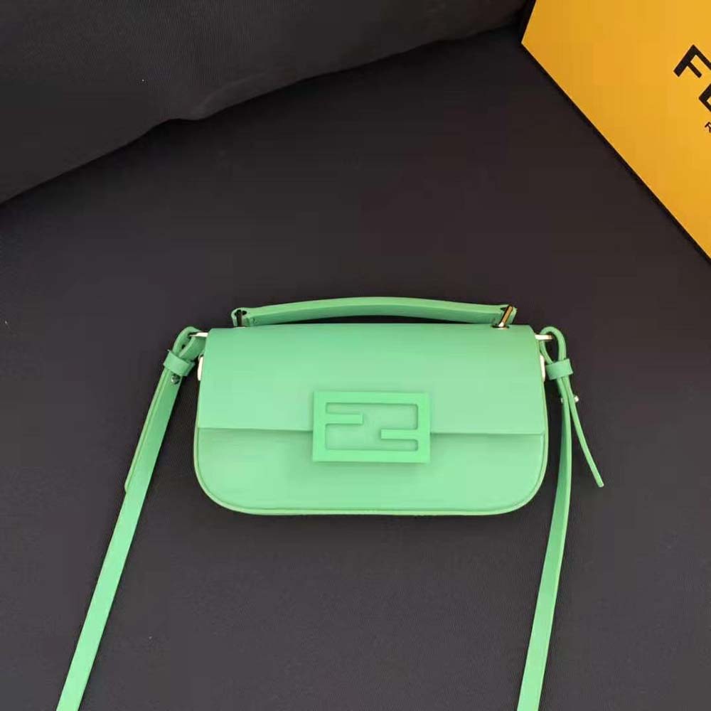 Close-up of gold-tone hardware on Fendi Women Baguette Phone Pouch Green Patent Leather Pouch