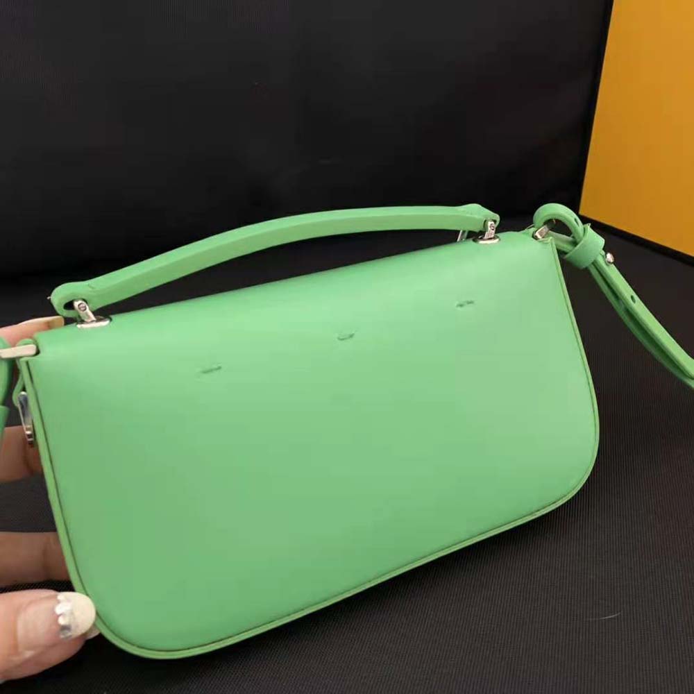 Side angle showing slim profile of Fendi Women Baguette Phone Pouch Green Patent Leather Pouch