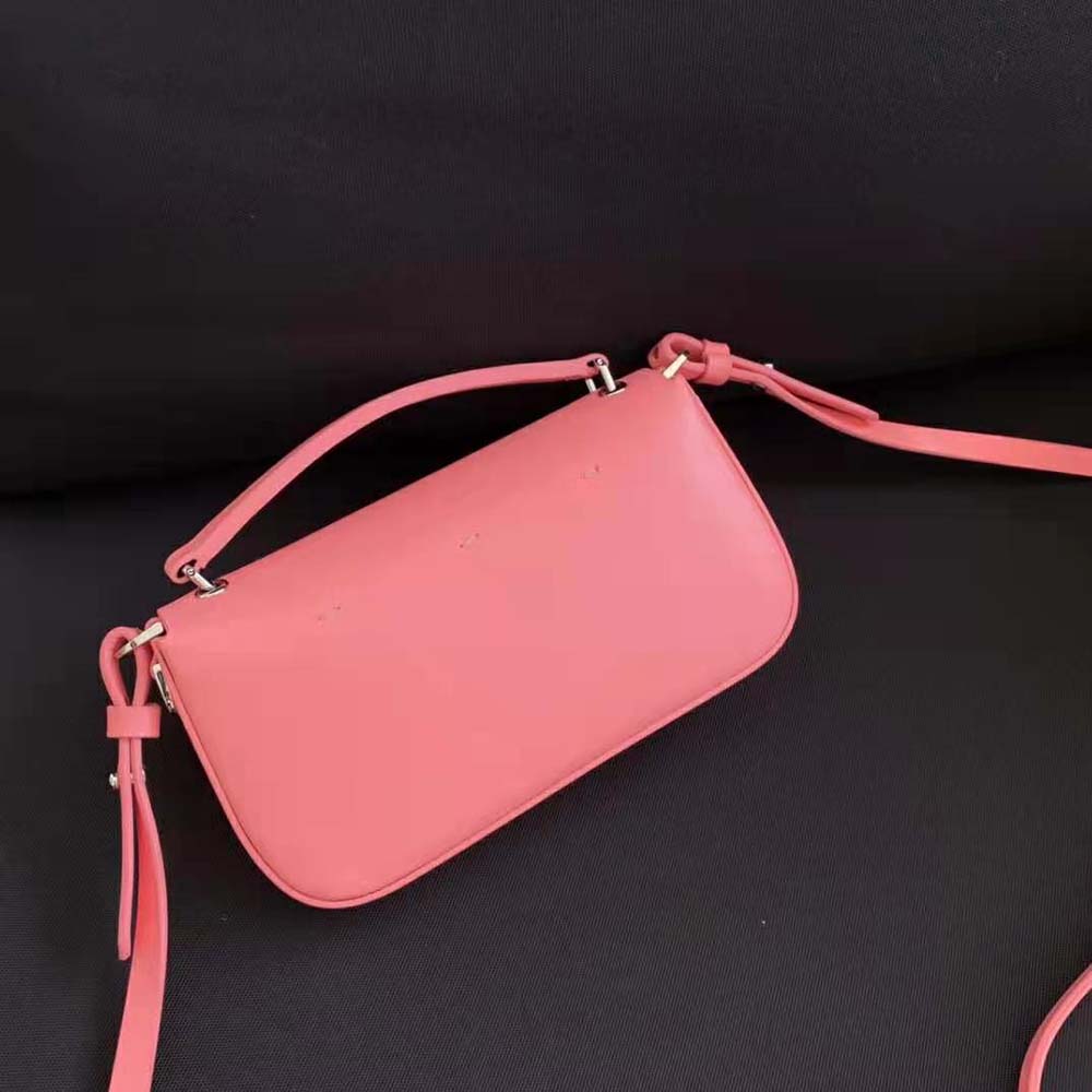 Side profile showing slim baguette silhouette of Fendi Women Baguette Phone Pouch