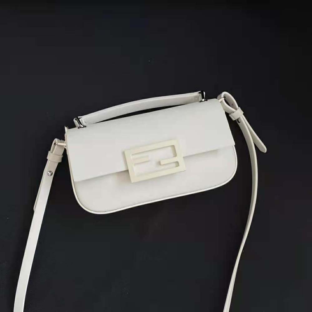 Close-up of gold-tone hardware on Fendi Women Baguette Phone Pouch