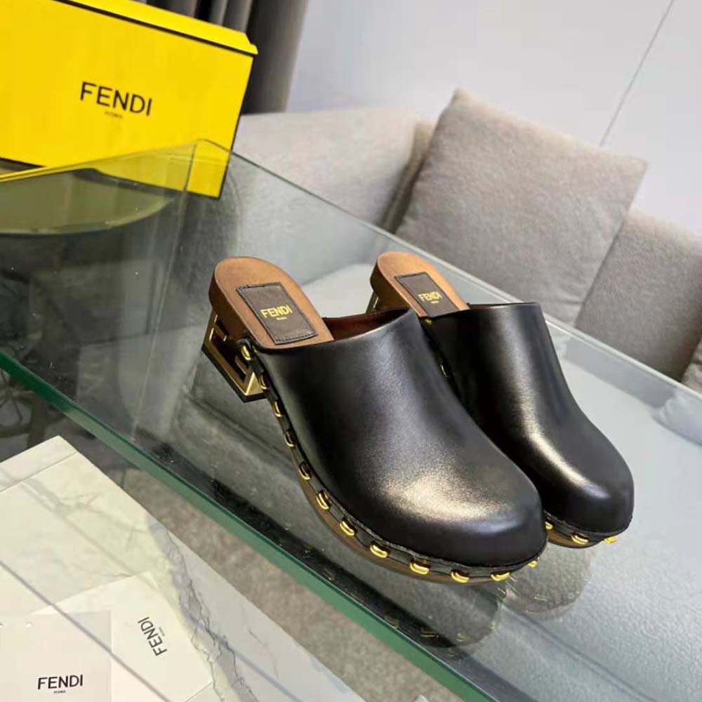Rear angle showing heel and leather texture of Fendi Women Baguette Show Black Leather Medium-Heel Clogs