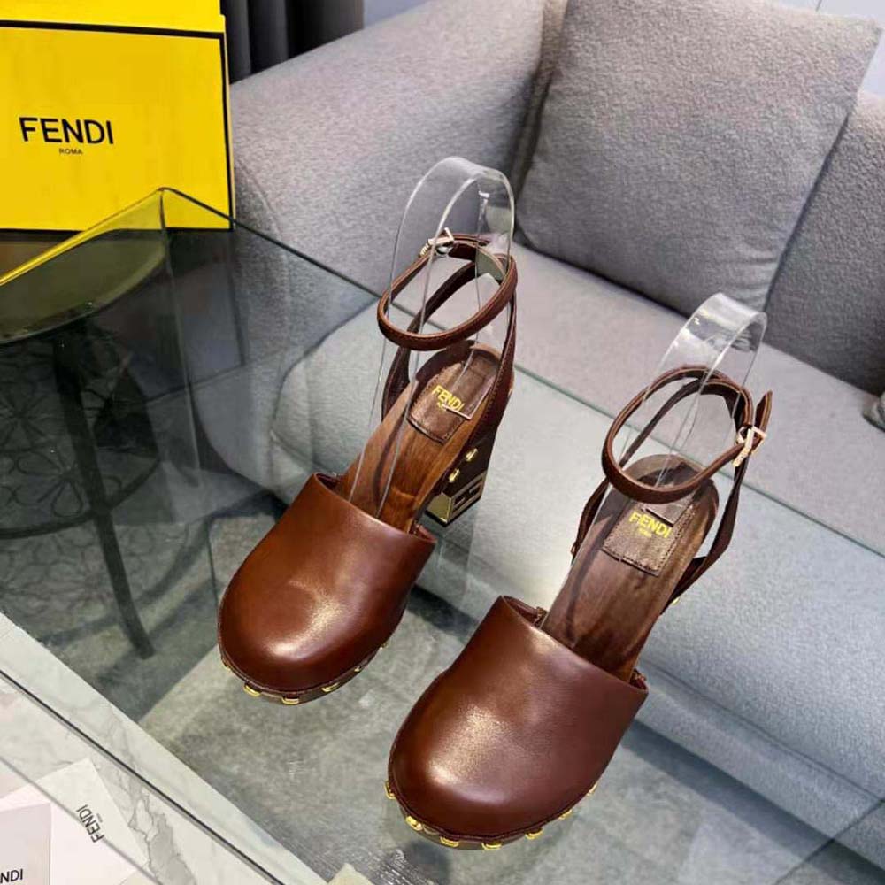 Close-up of signature baguette hardware on Fendi Brown Leather High-Heeled Clogs