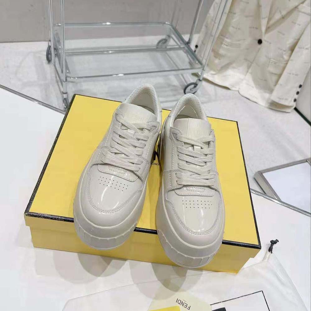 Close-up of Fendi leather texture and embossed logo details on low-tops