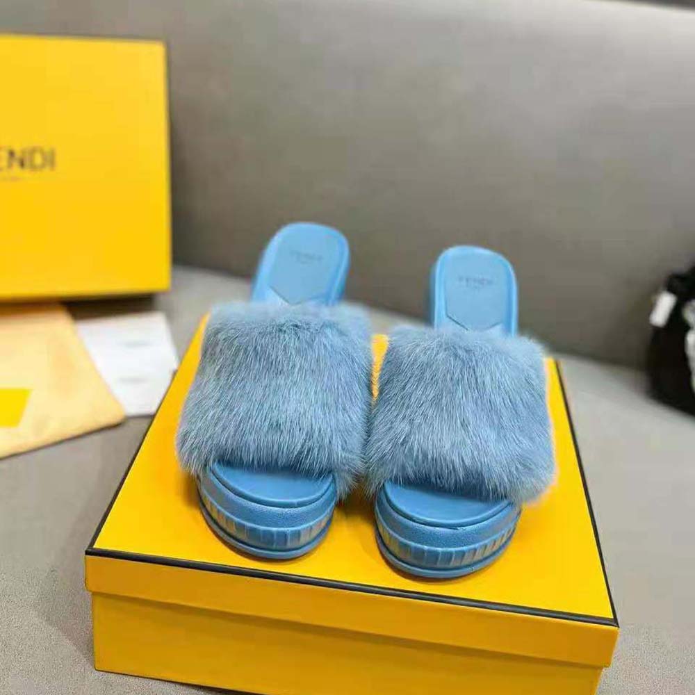 Close-up of Fendi logo hardware on Blue Mink Slides upper
