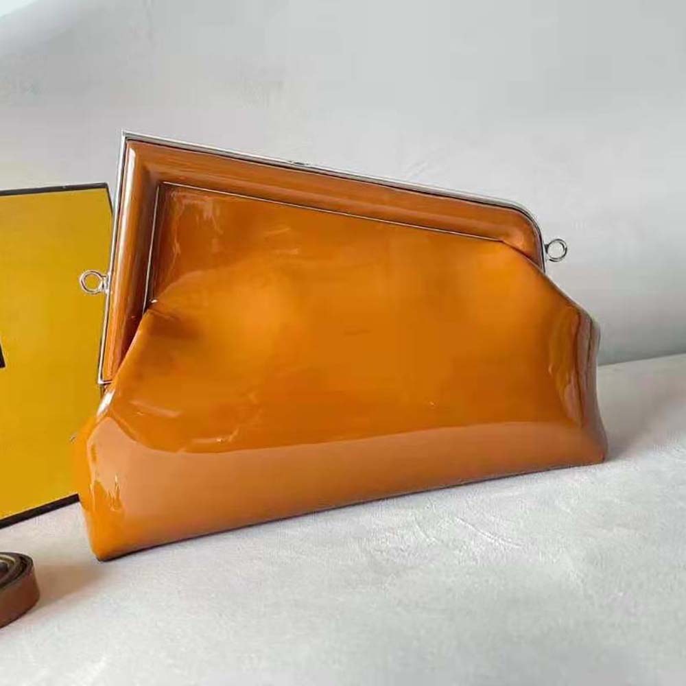 Side angle showing structured silhouette of Fendi Women First Midi Brown Bag